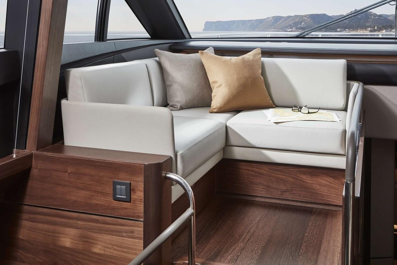 a couch in a room aboard SHINE Yacht for Sale