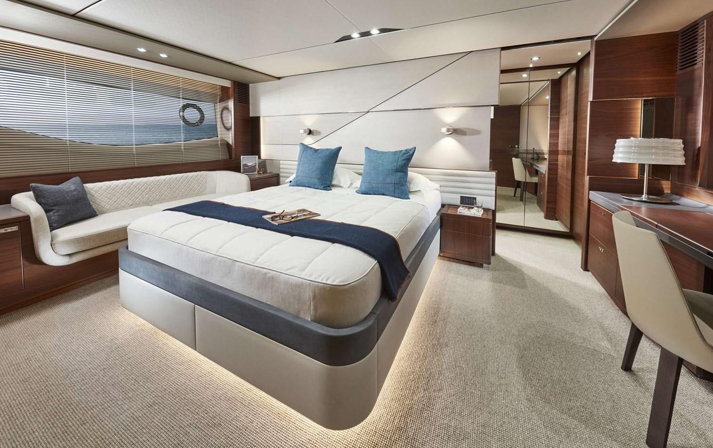 a hotel room with a bed and a desk aboard SHINE Yacht for Sale