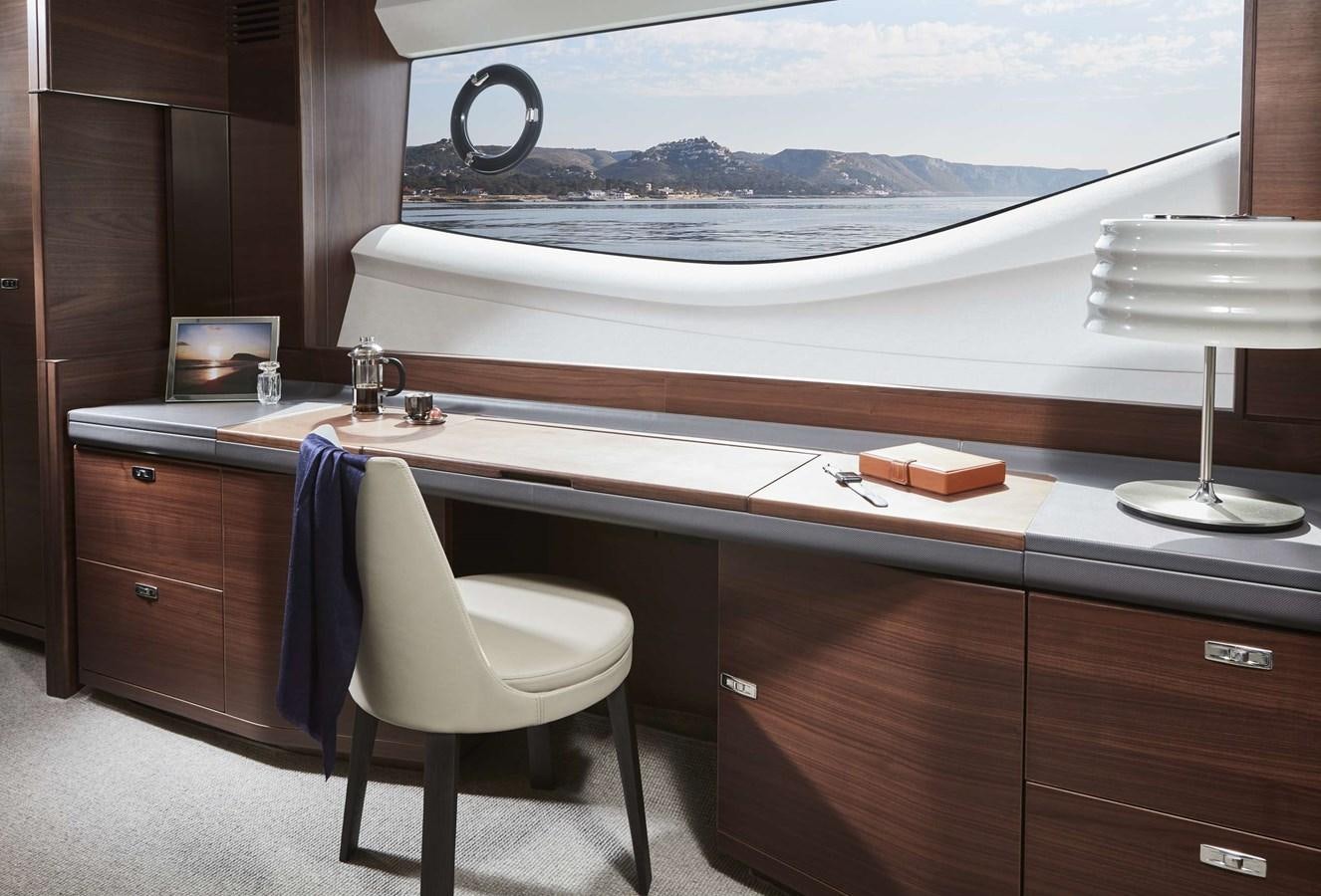 a desk with a chair and a window aboard SHINE Yacht for Sale