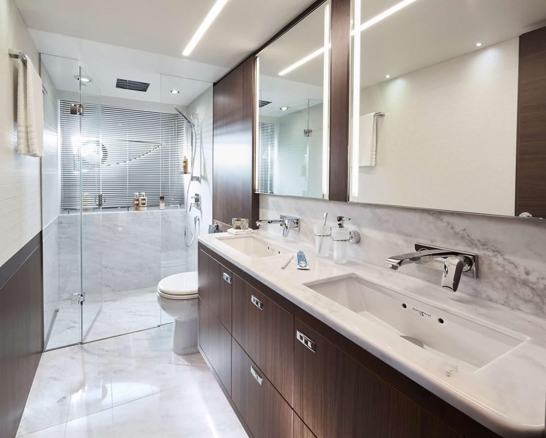 a bathroom with a glass shower aboard SHINE Yacht for Sale