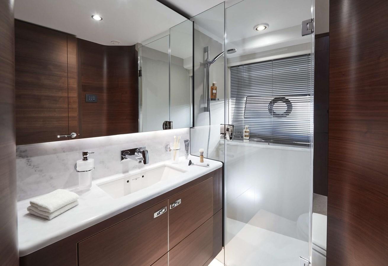 a bathroom with a large mirror aboard SHINE Yacht for Sale