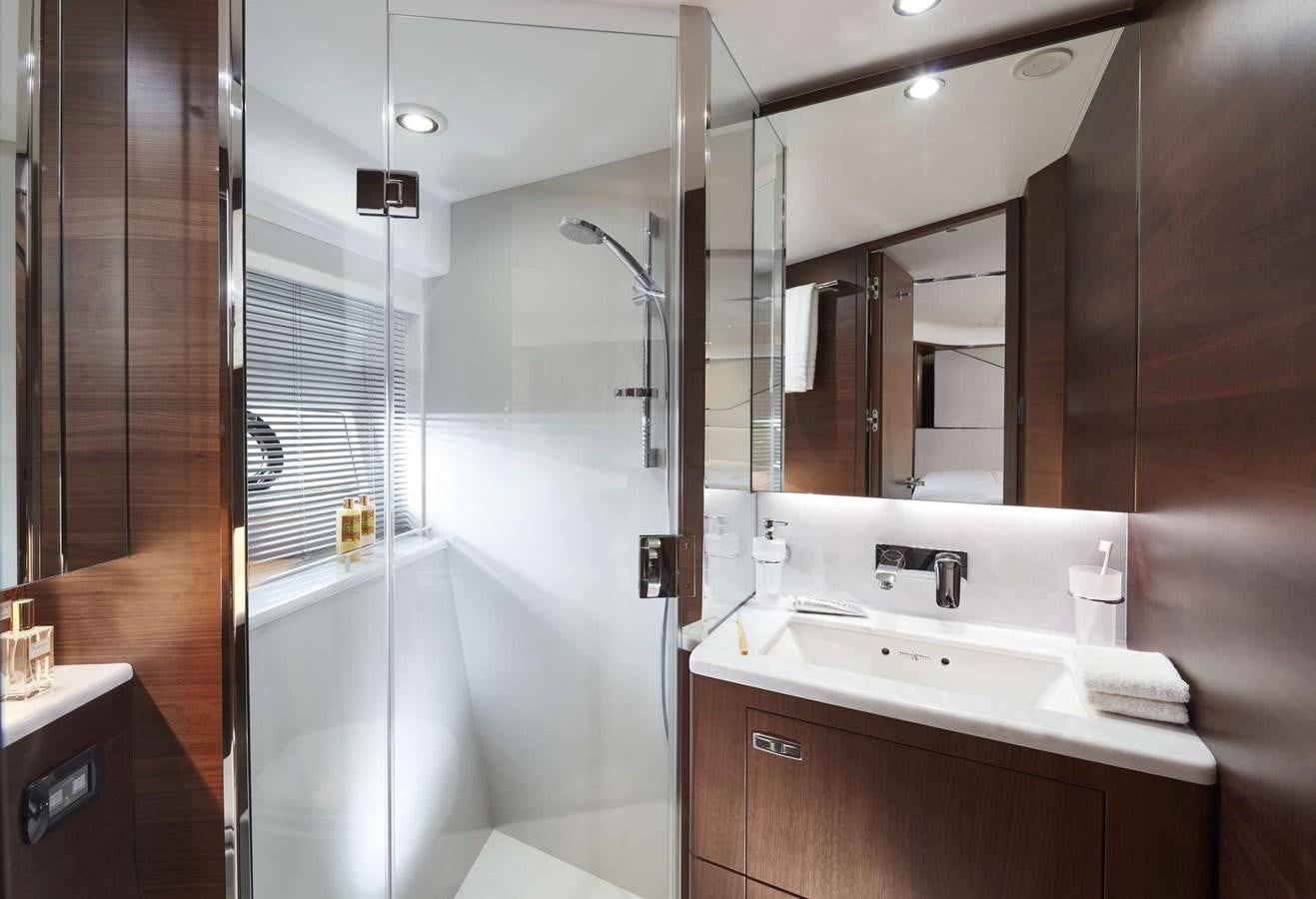 a bathroom with a shower and sink aboard SHINE Yacht for Sale