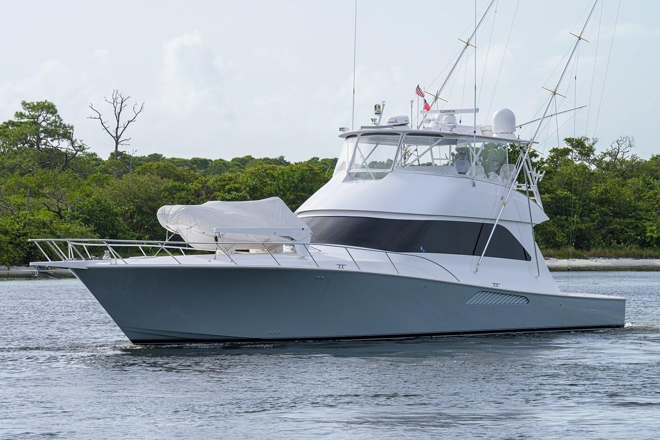 a white boat in the water aboard 68 CONVERTIBLE Yacht for Sale
