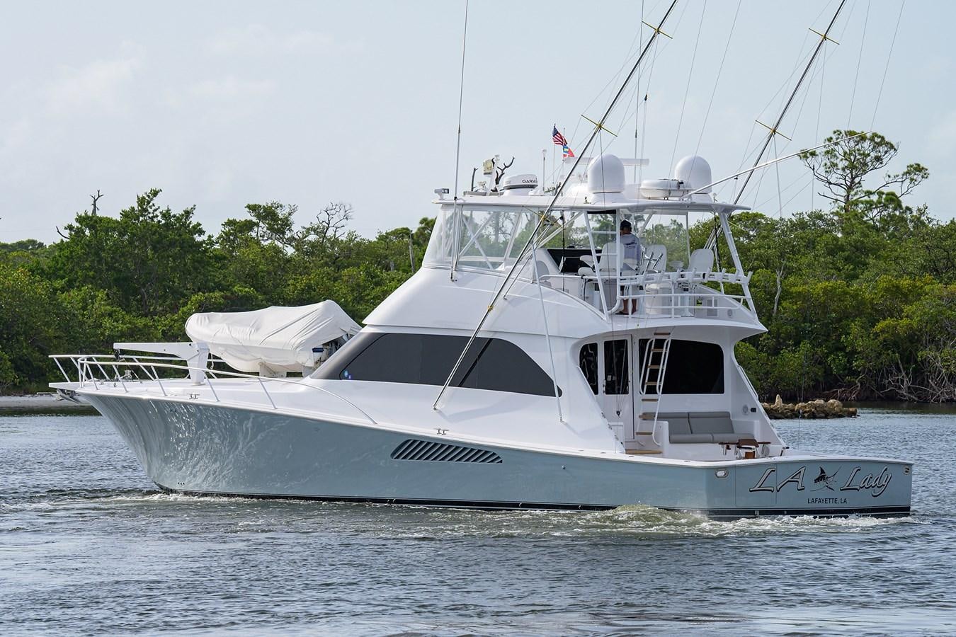 a white boat on the water aboard 68 CONVERTIBLE Yacht for Sale