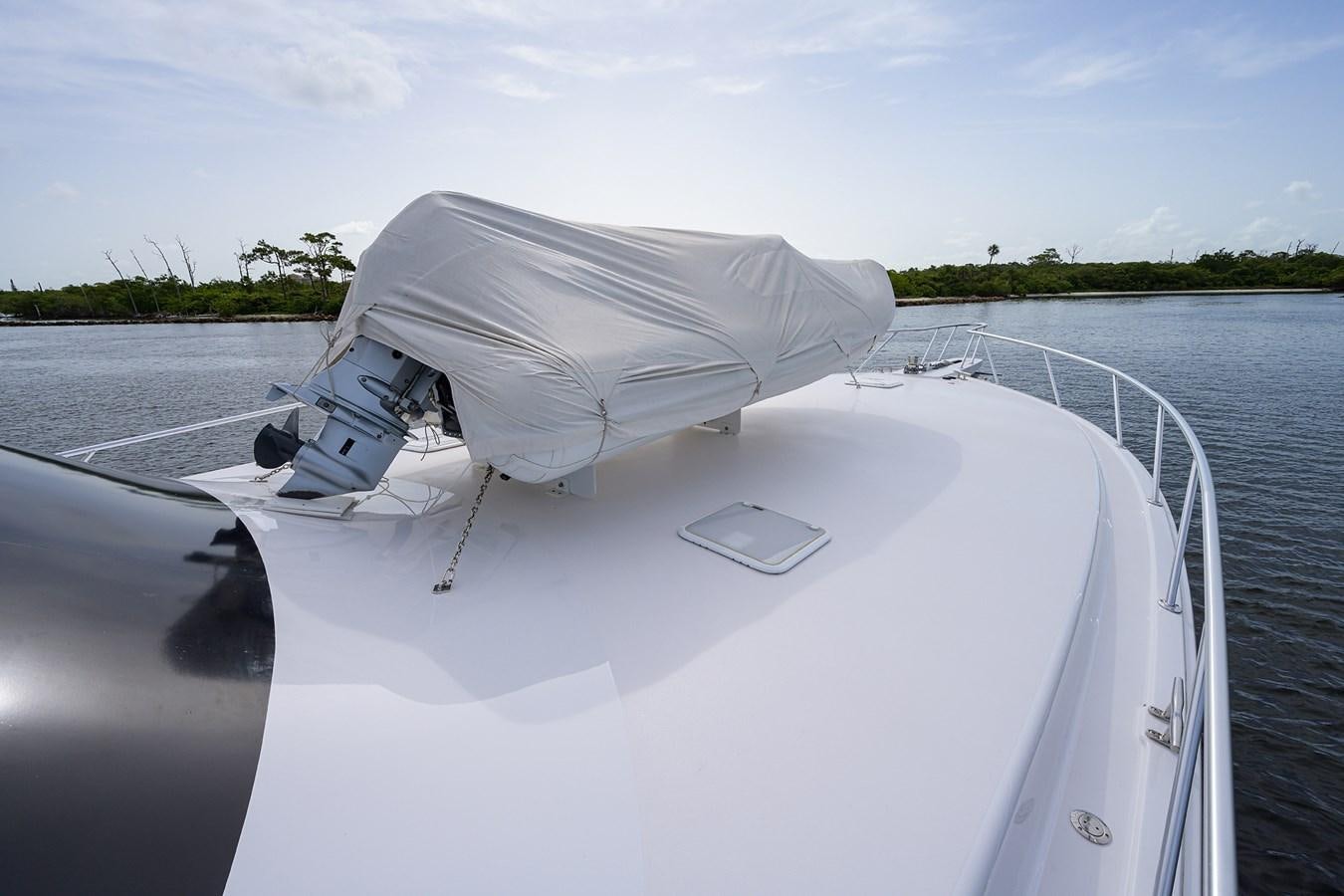 a boat with a white cover on the front aboard 68 CONVERTIBLE Yacht for Sale