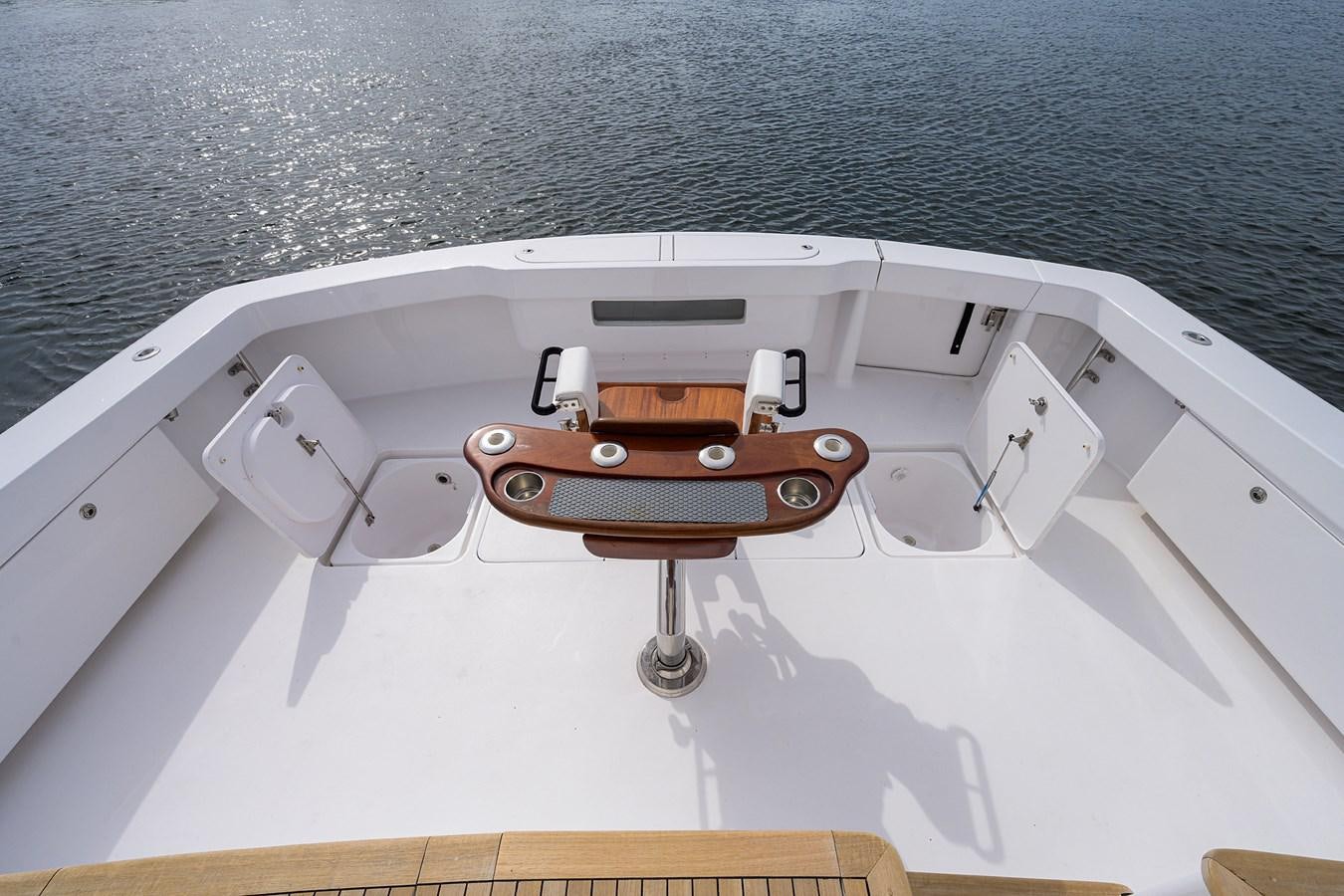 a wooden boat on a body of water aboard 68 CONVERTIBLE Yacht for Sale