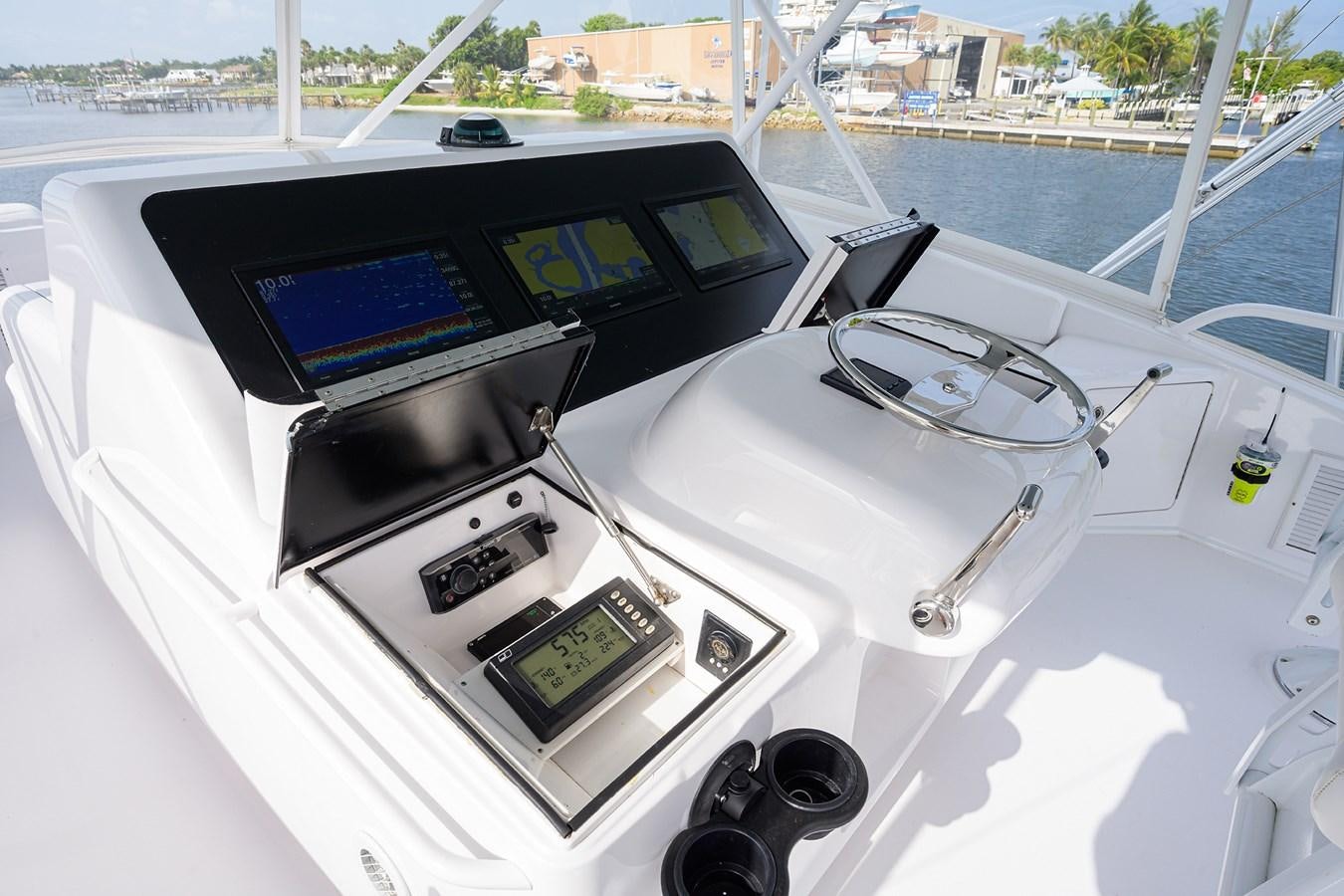a car on a boat aboard 68 CONVERTIBLE Yacht for Sale