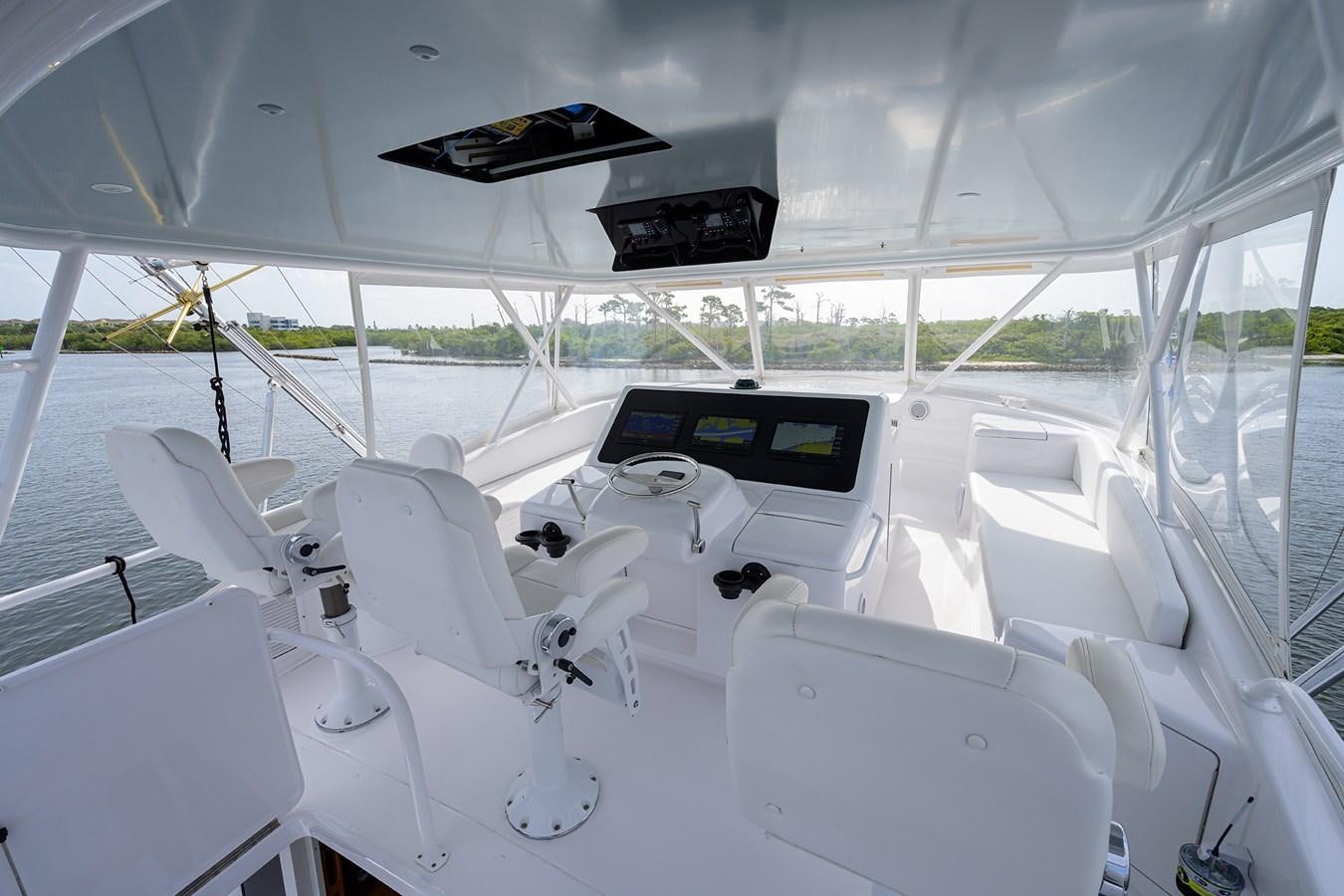 a group of white chairs on a boat aboard 68 CONVERTIBLE Yacht for Sale