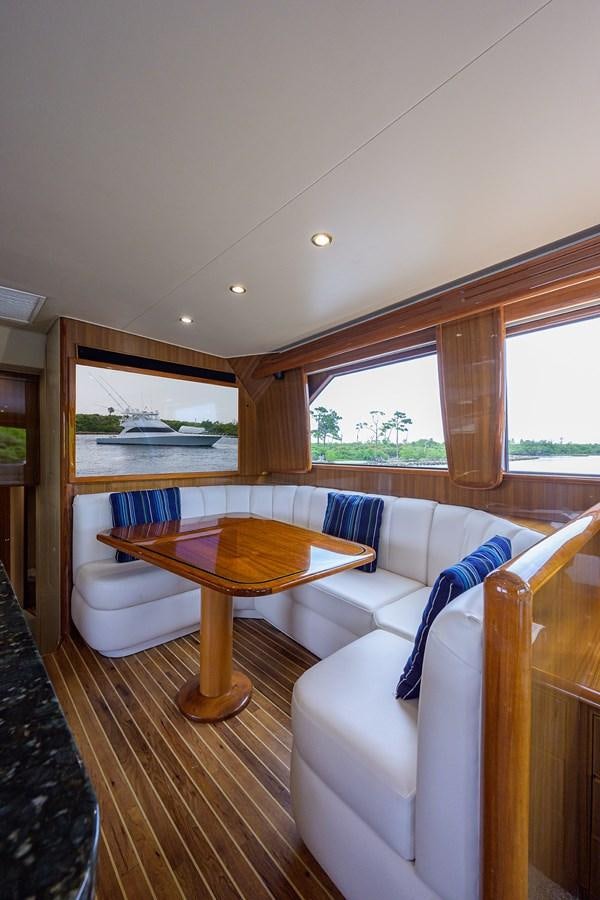 a living room with a couch and a table aboard 68 CONVERTIBLE Yacht for Sale