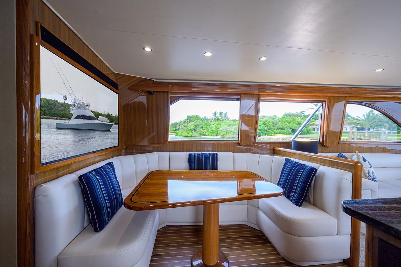 a room with a table and chairs aboard 68 CONVERTIBLE Yacht for Sale