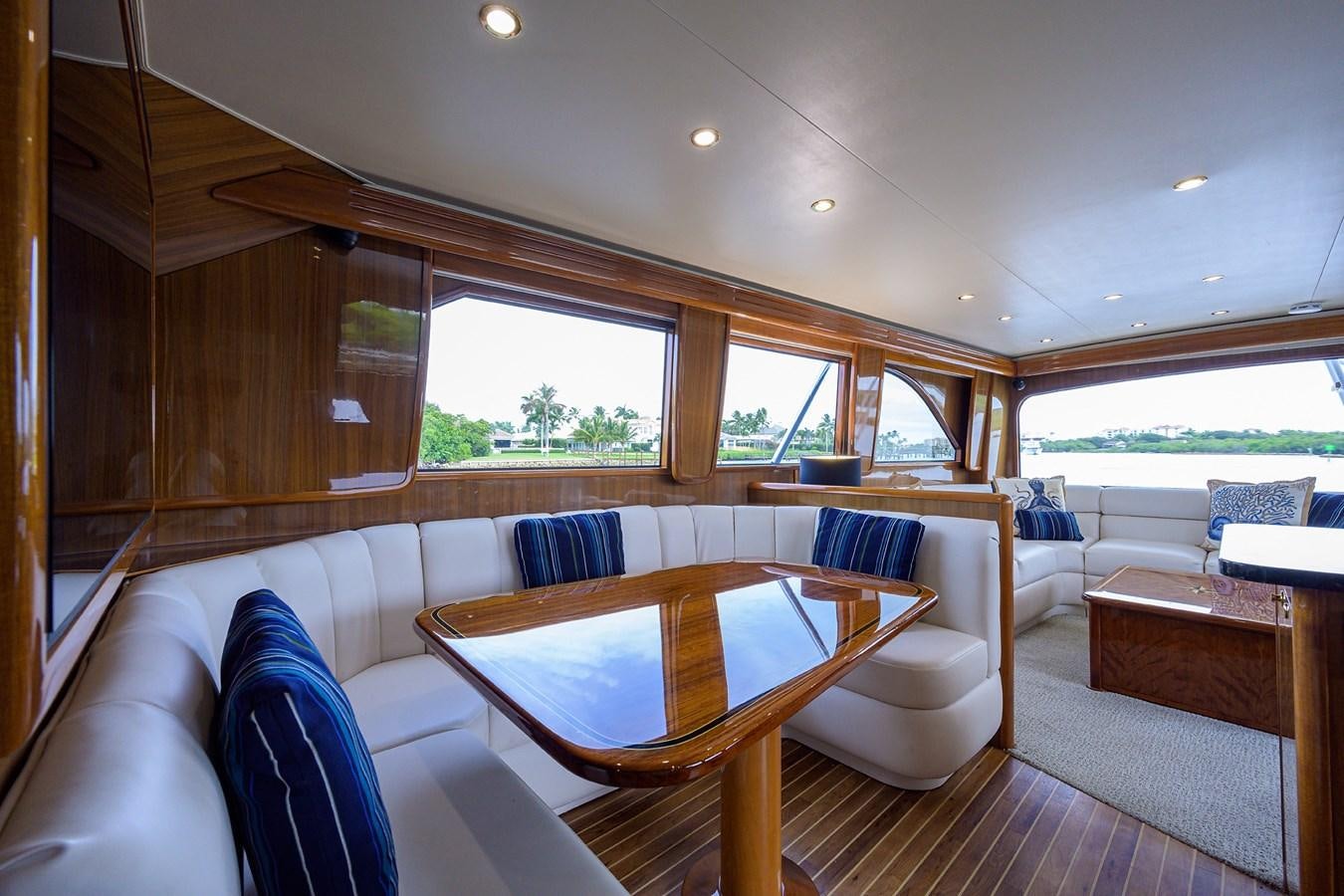 a living room with a couch and a table aboard 68 CONVERTIBLE Yacht for Sale