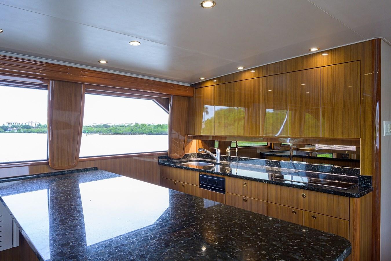 a large kitchen with a large island aboard 68 CONVERTIBLE Yacht for Sale