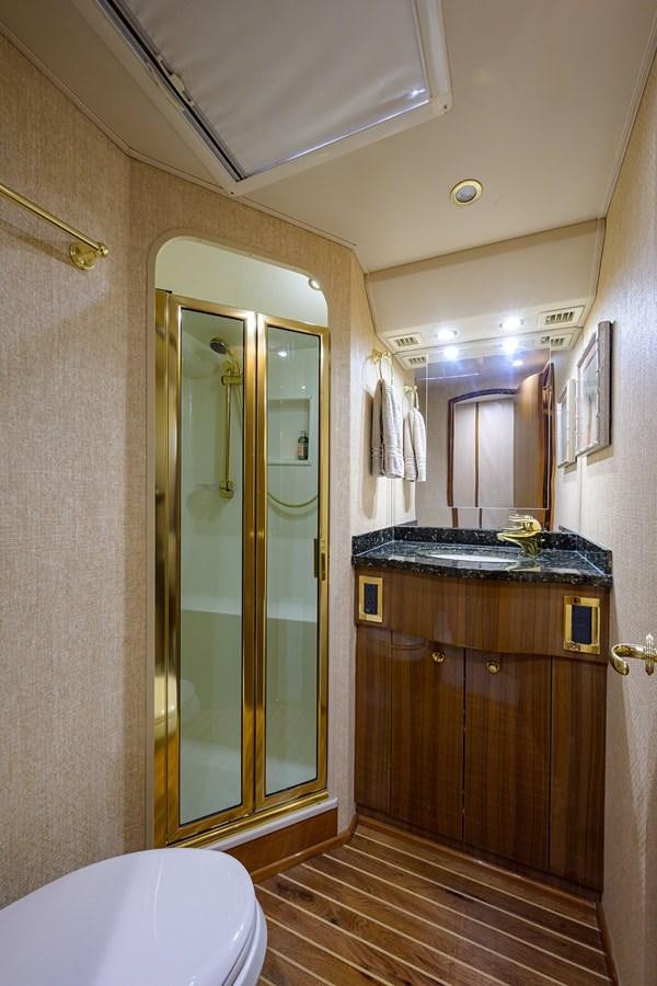 a bathroom with a glass shower door aboard 68 CONVERTIBLE Yacht for Sale