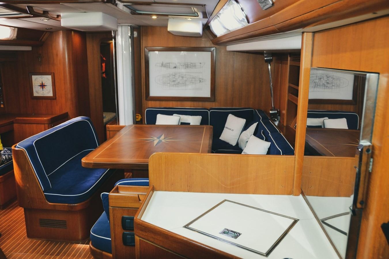 a room with desks and chairs aboard DESIRADE III Yacht for Sale