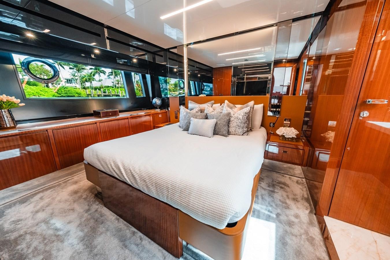 a room with a bed and a window aboard REGENCY Yacht for Sale
