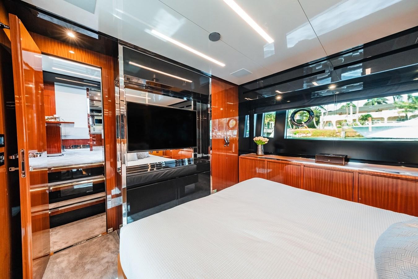 a room with a bed and a closet aboard REGENCY Yacht for Sale