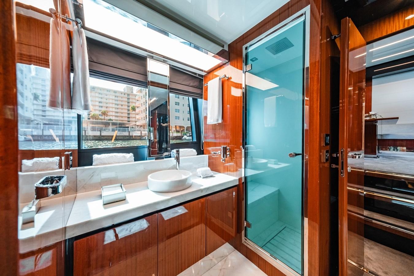 a bathroom with a sink and a mirror aboard REGENCY Yacht for Sale