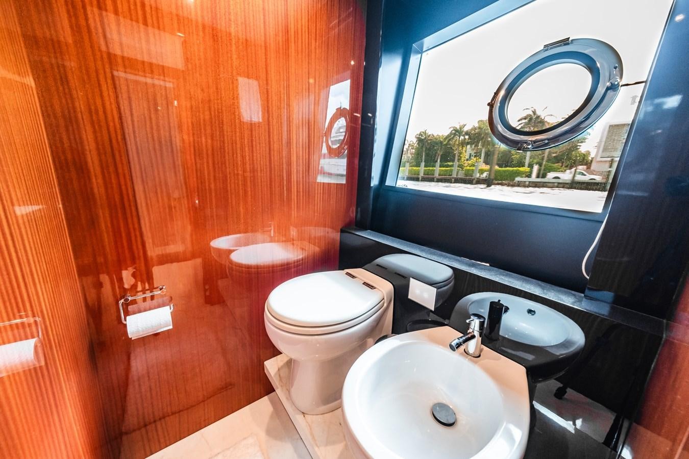 a bathroom with a sink and a toilet aboard REGENCY Yacht for Sale