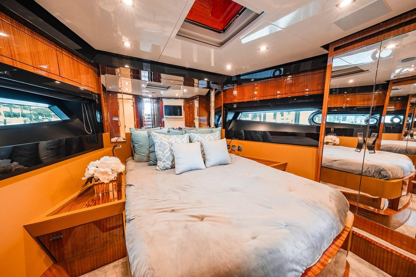 a room with a bed and a tv aboard REGENCY Yacht for Sale