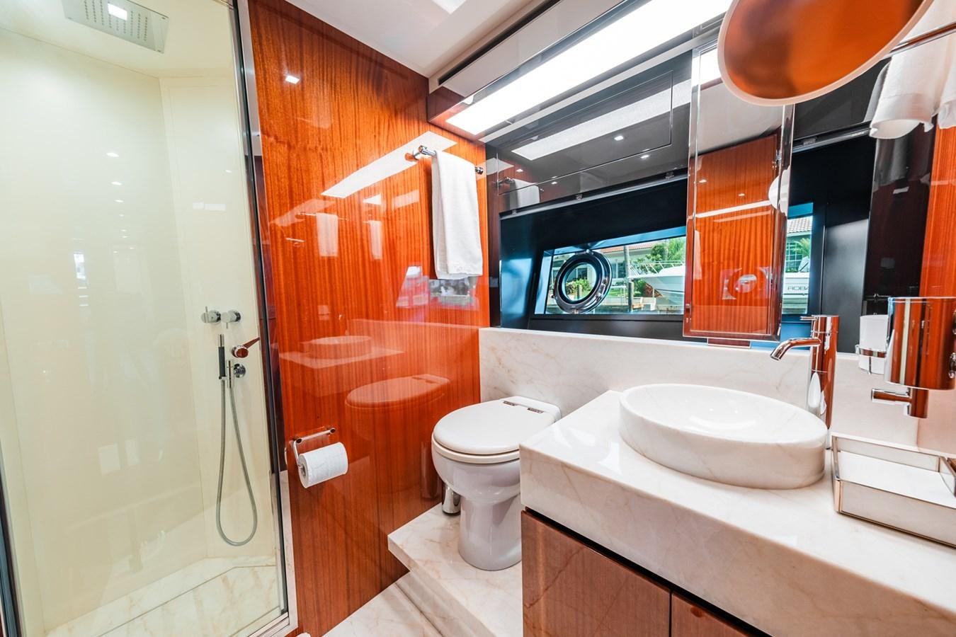 a bathroom with a sink and toilet aboard REGENCY Yacht for Sale