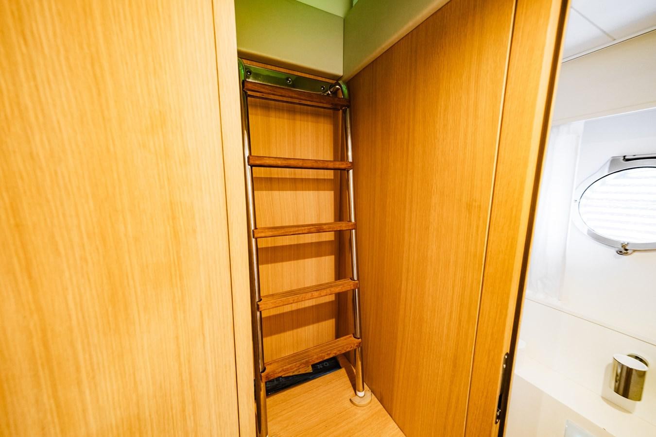 a wooden cabinet in a room aboard REGENCY Yacht for Sale
