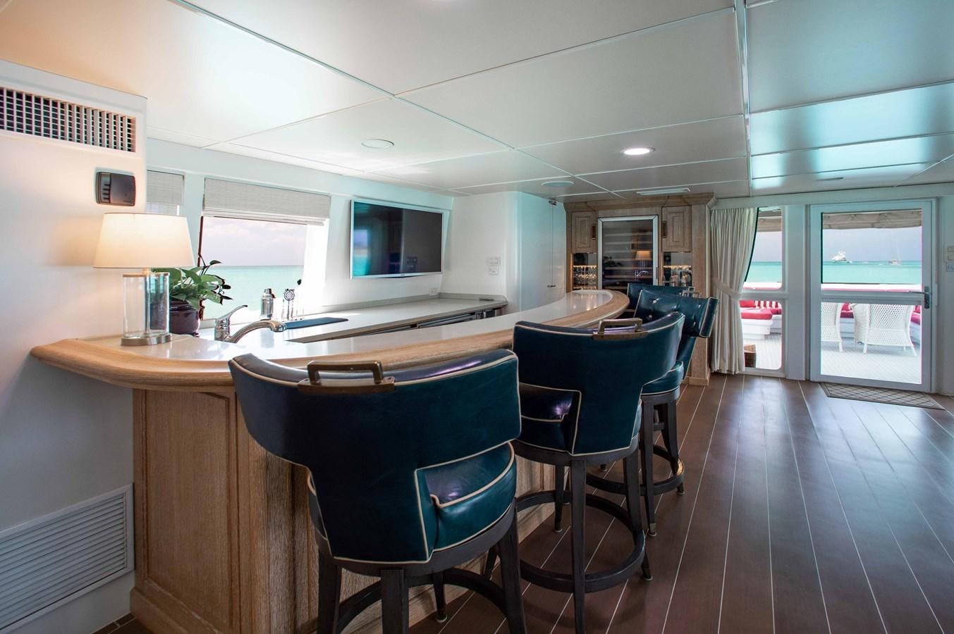 a kitchen with a table and chairs aboard PEGASUS IX Yacht for Sale