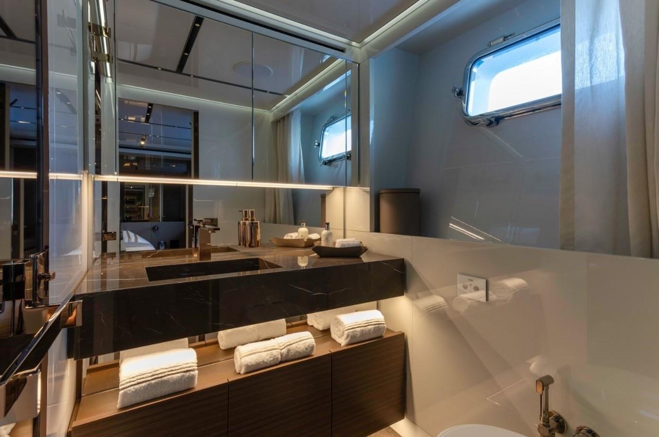 a bathroom with a large mirror aboard STRADIVARIUS Yacht for Sale