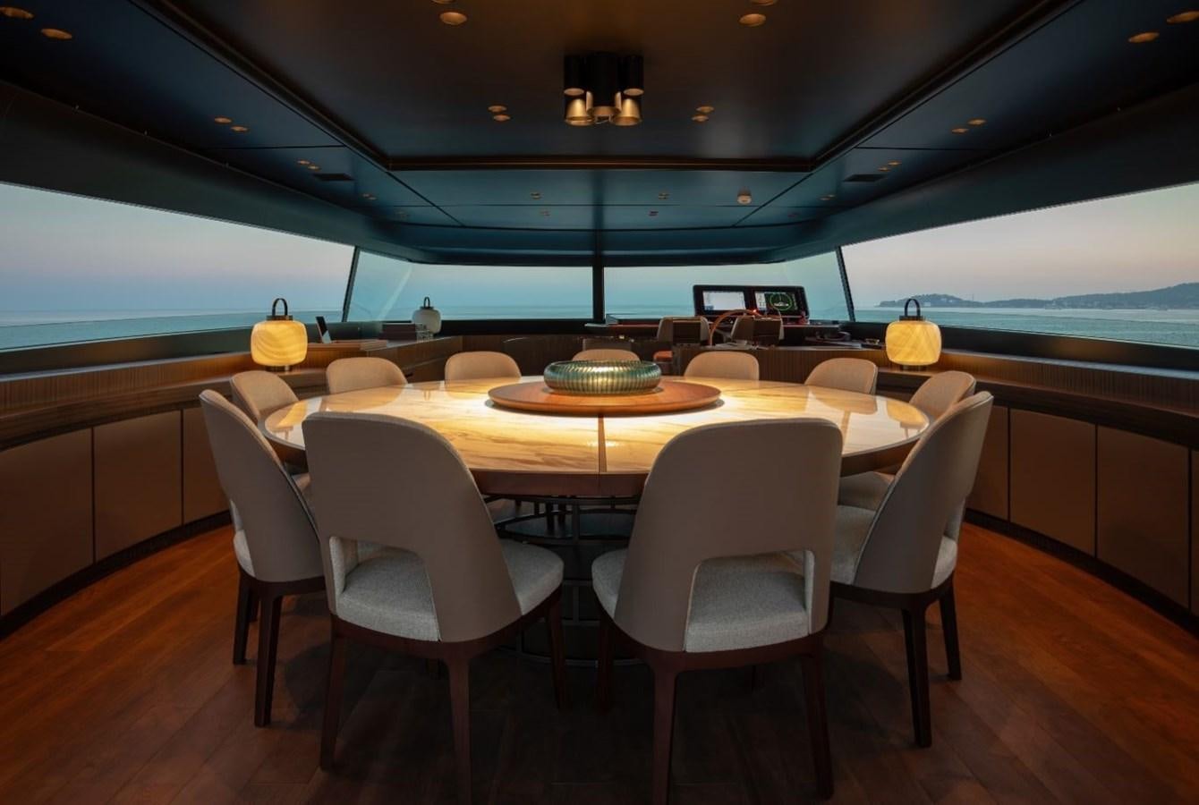 a room with a table and chairs aboard STRADIVARIUS Yacht for Sale