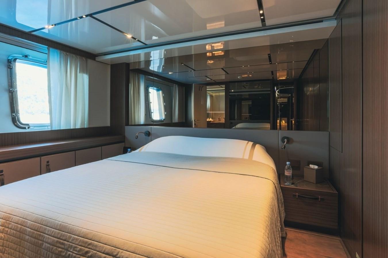 a bed in a room aboard STRADIVARIUS Yacht for Sale