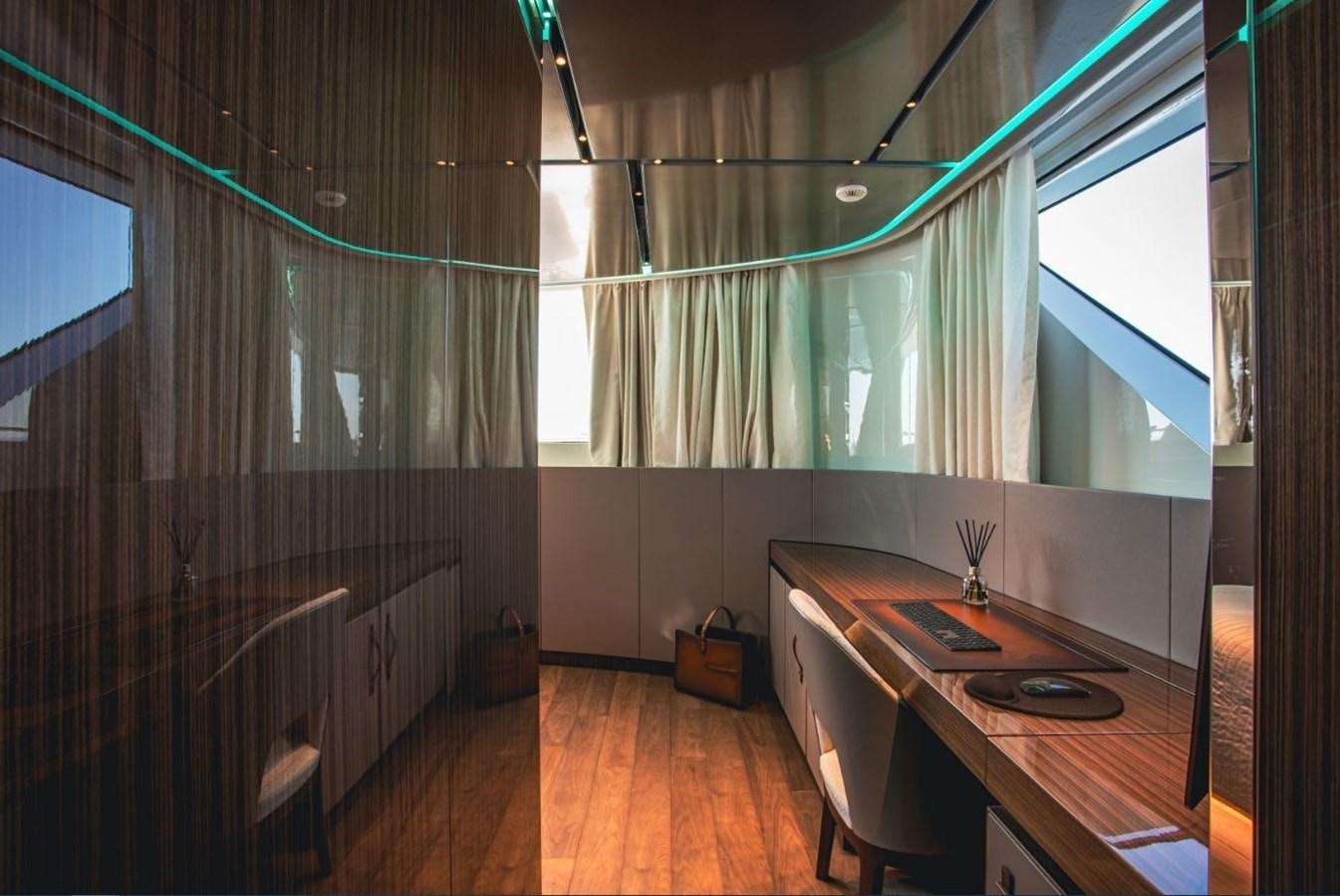 a room with a table and chairs aboard STRADIVARIUS Yacht for Sale