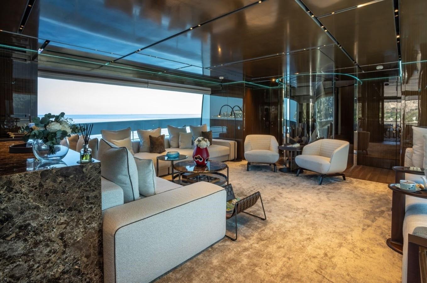 a room with a couch and a coffee table aboard STRADIVARIUS Yacht for Sale