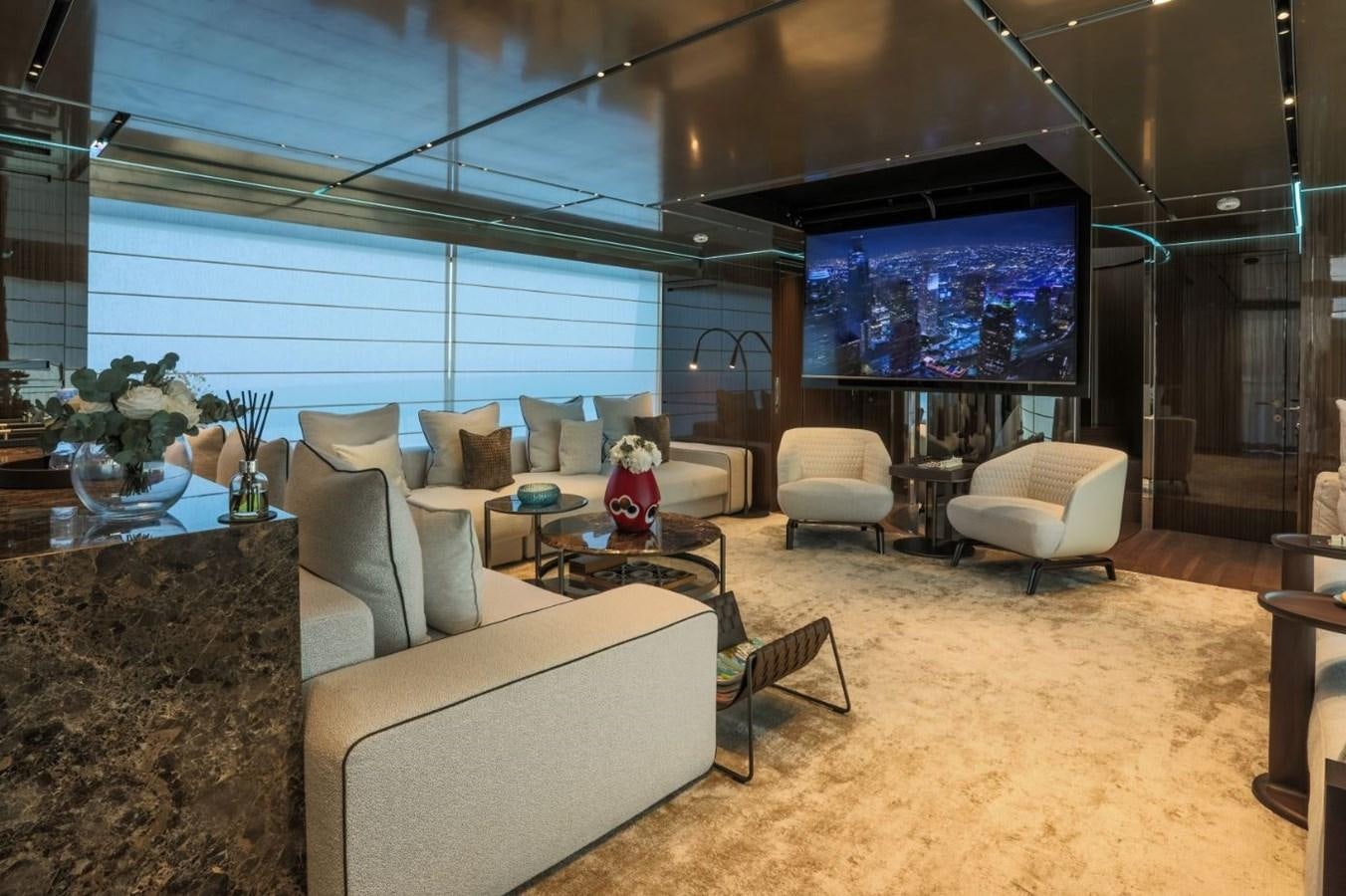 a living room with a large screen aboard STRADIVARIUS Yacht for Sale