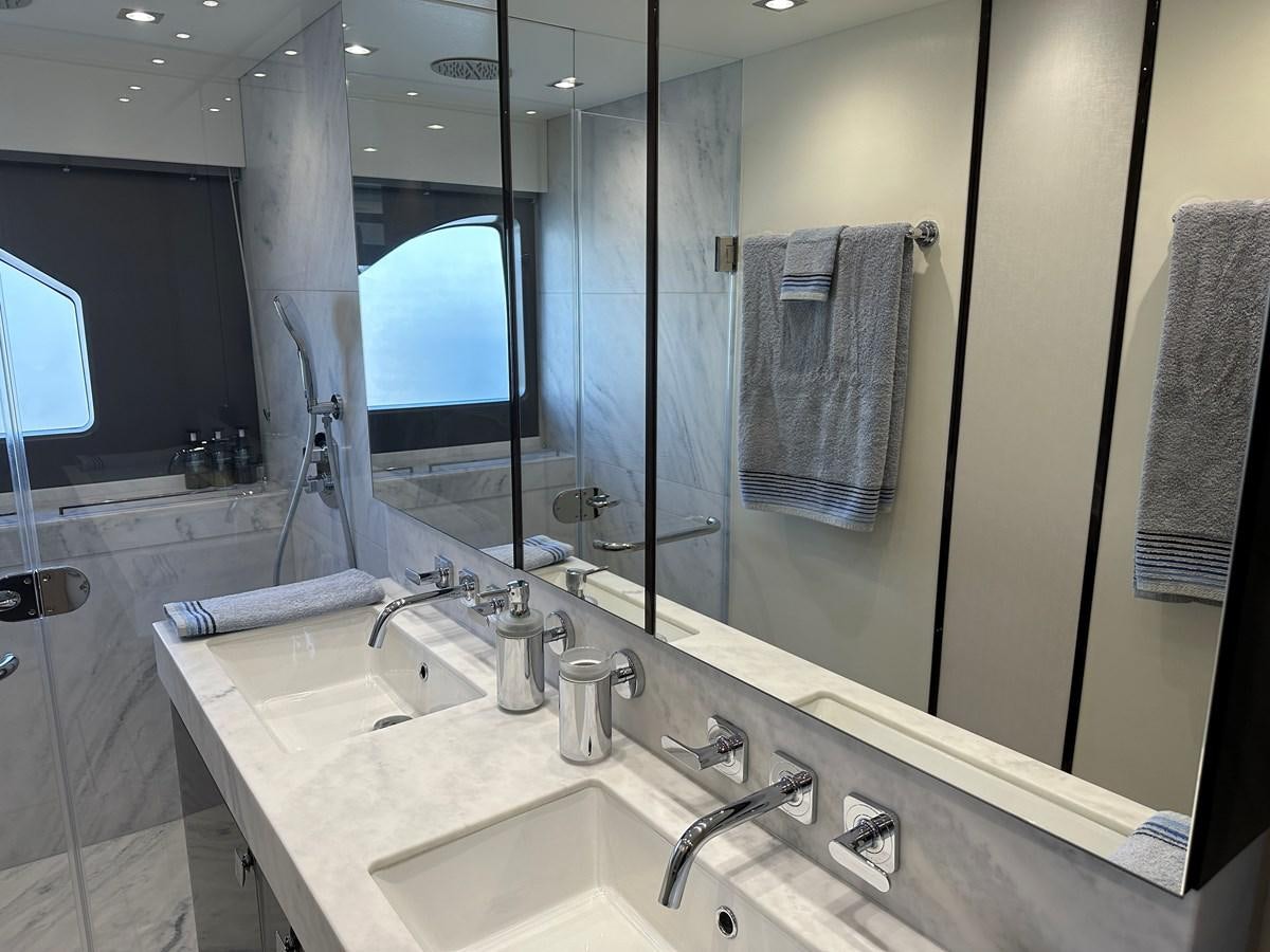 a bathroom with a large mirror aboard K NUK Yacht for Sale