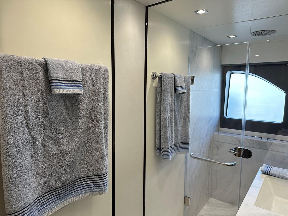 a bathroom with a towel rack and a mirror aboard K NUK Yacht for Sale
