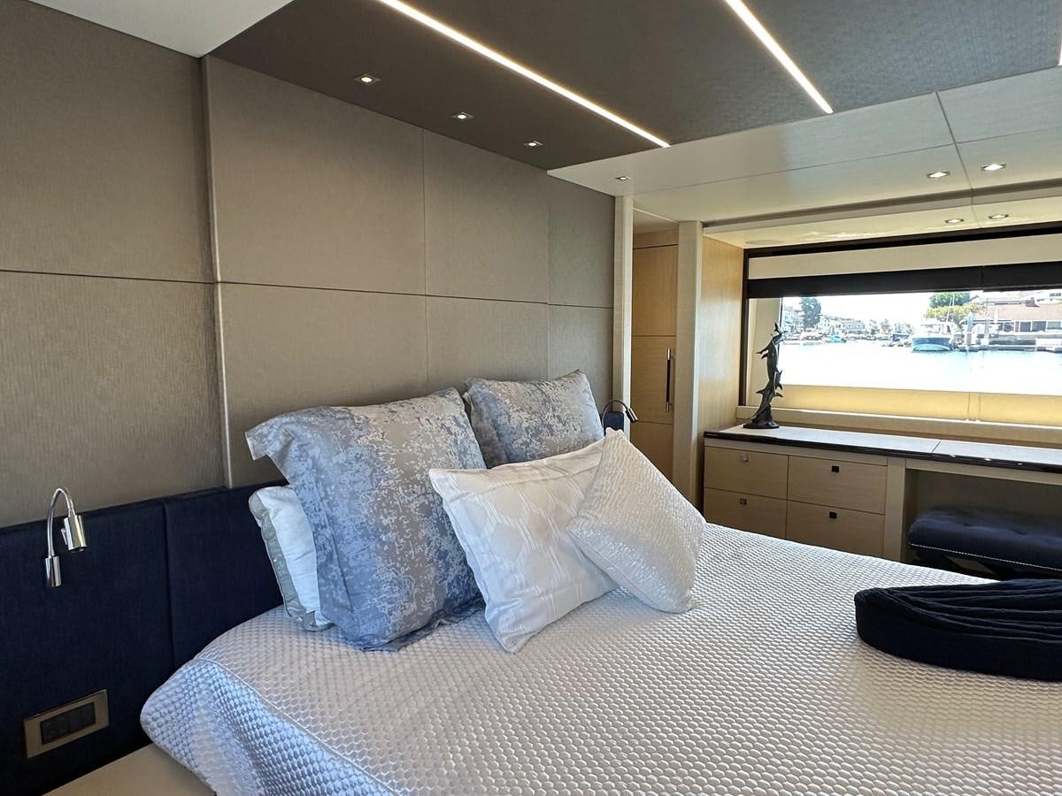 a bed with white sheets aboard K NUK Yacht for Sale