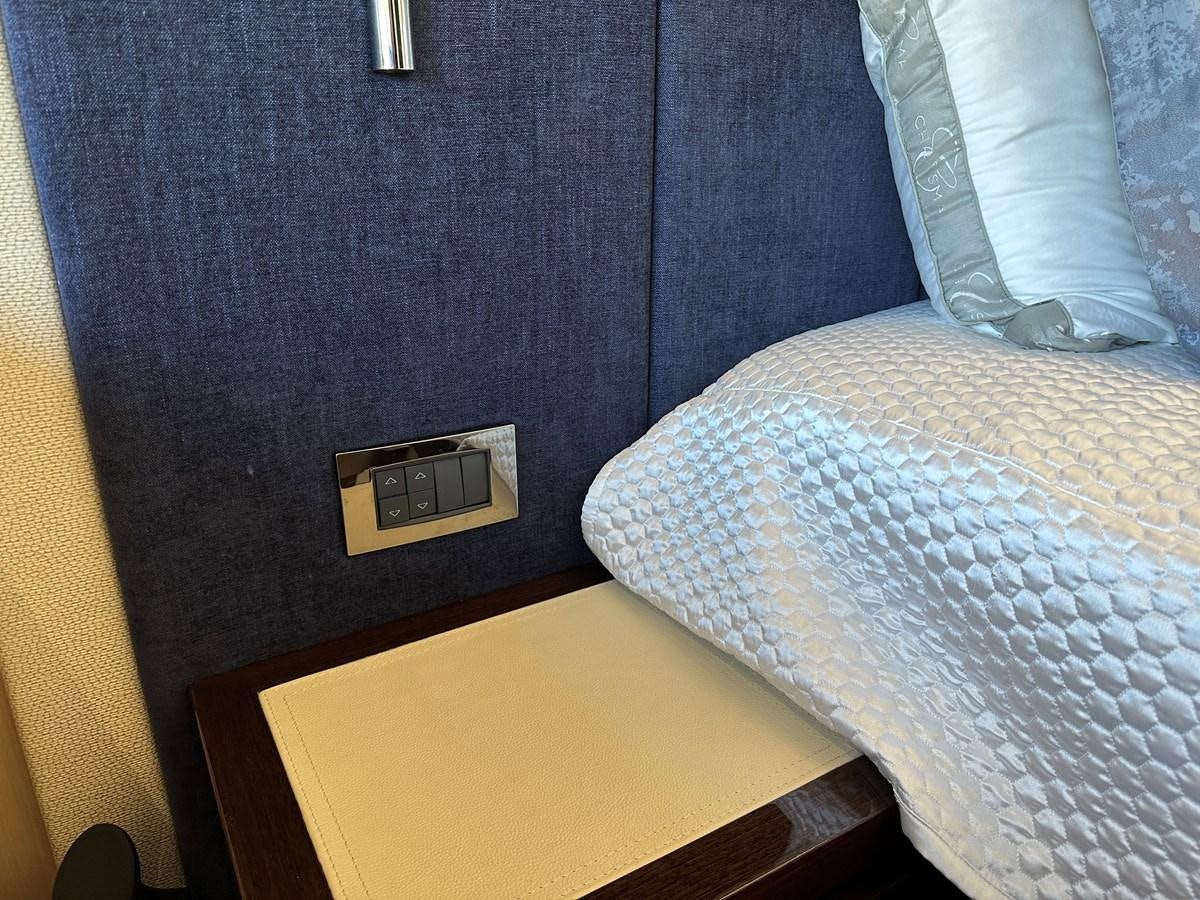 a bed with a white sheet aboard K NUK Yacht for Sale