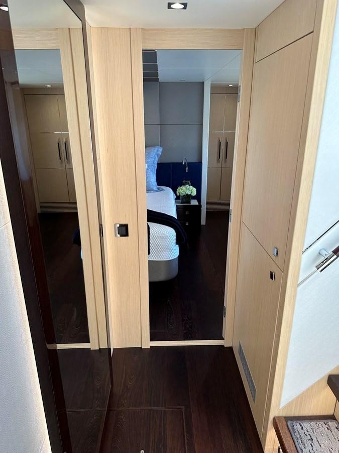 a hallway with a door and a bed in it aboard K NUK Yacht for Sale