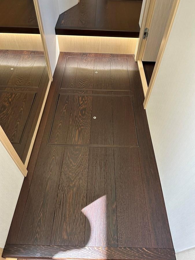 a wooden floor with a white wall aboard K NUK Yacht for Sale