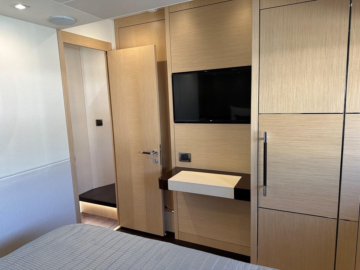 a room with a tv and a closet aboard K NUK Yacht for Sale