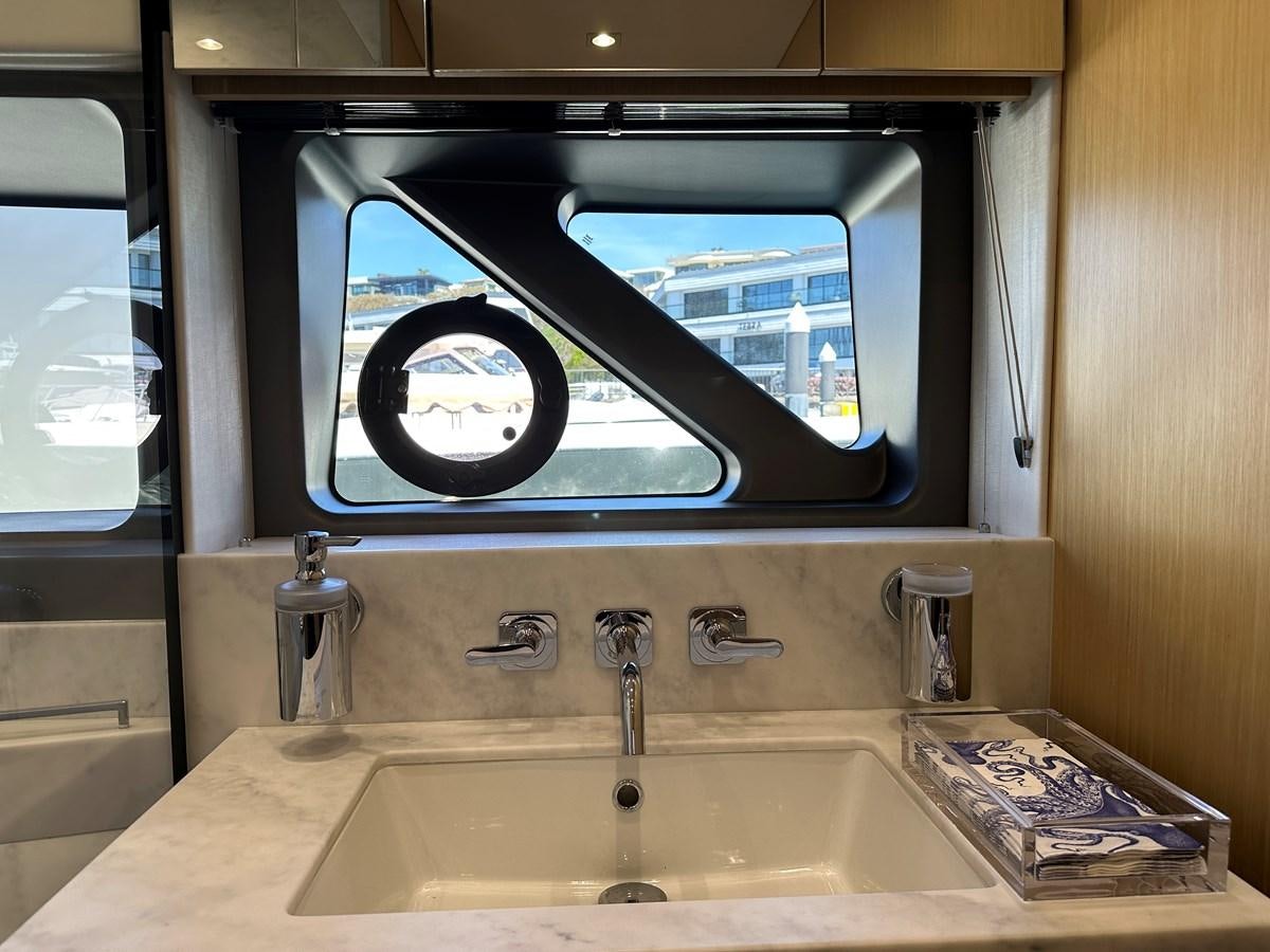 a bathroom sink with a large mirror aboard K NUK Yacht for Sale