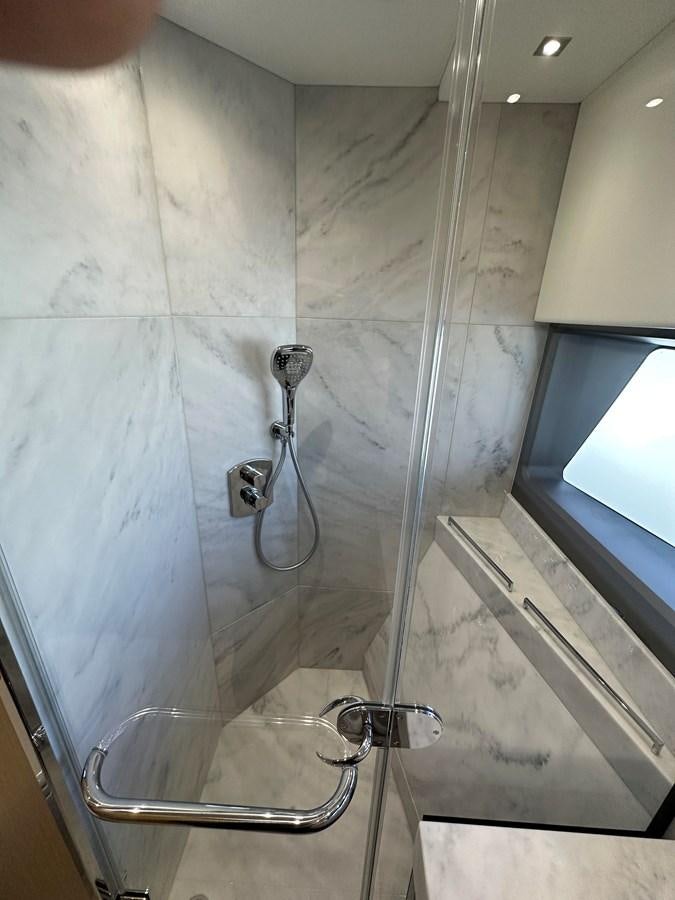 a shower with a glass door aboard K NUK Yacht for Sale