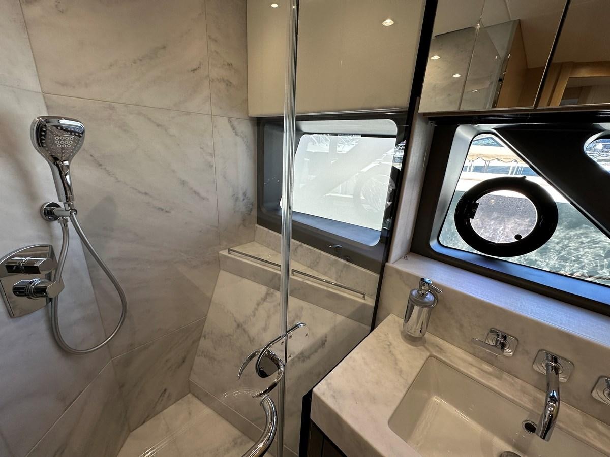 a bathroom with a sink and a microwave aboard K NUK Yacht for Sale