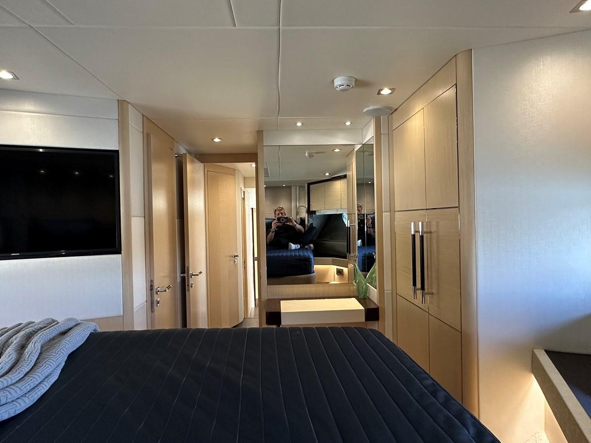 a person sitting on a bed aboard K NUK Yacht for Sale
