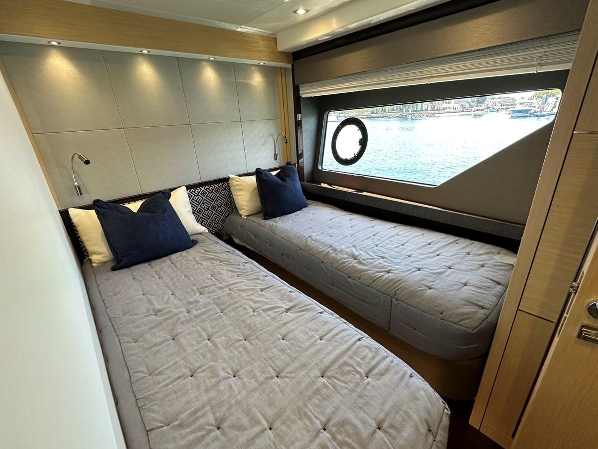 a bed with a large window aboard K NUK Yacht for Sale
