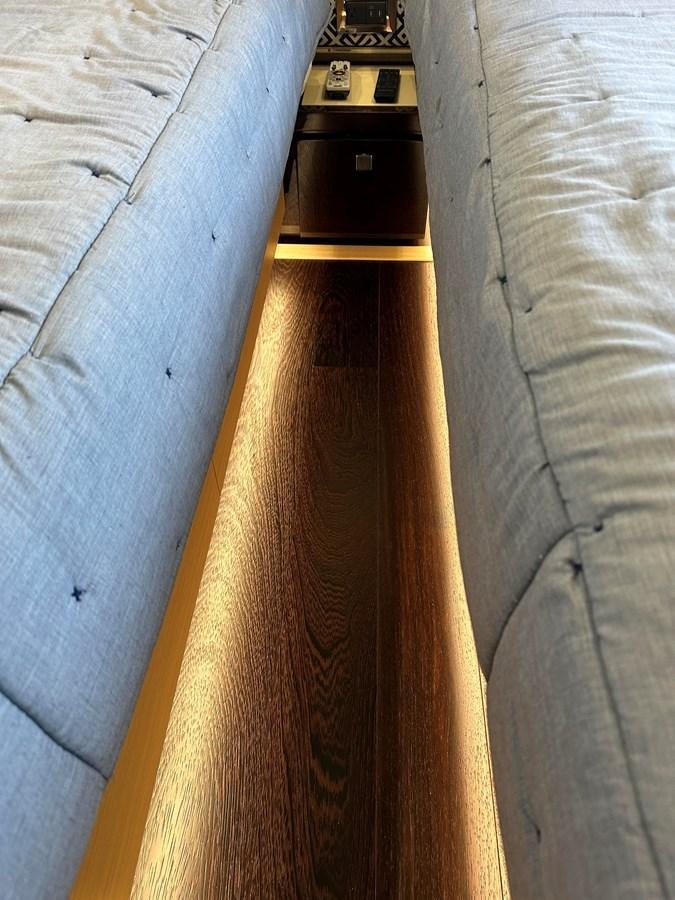a wood board on a bed aboard K NUK Yacht for Sale