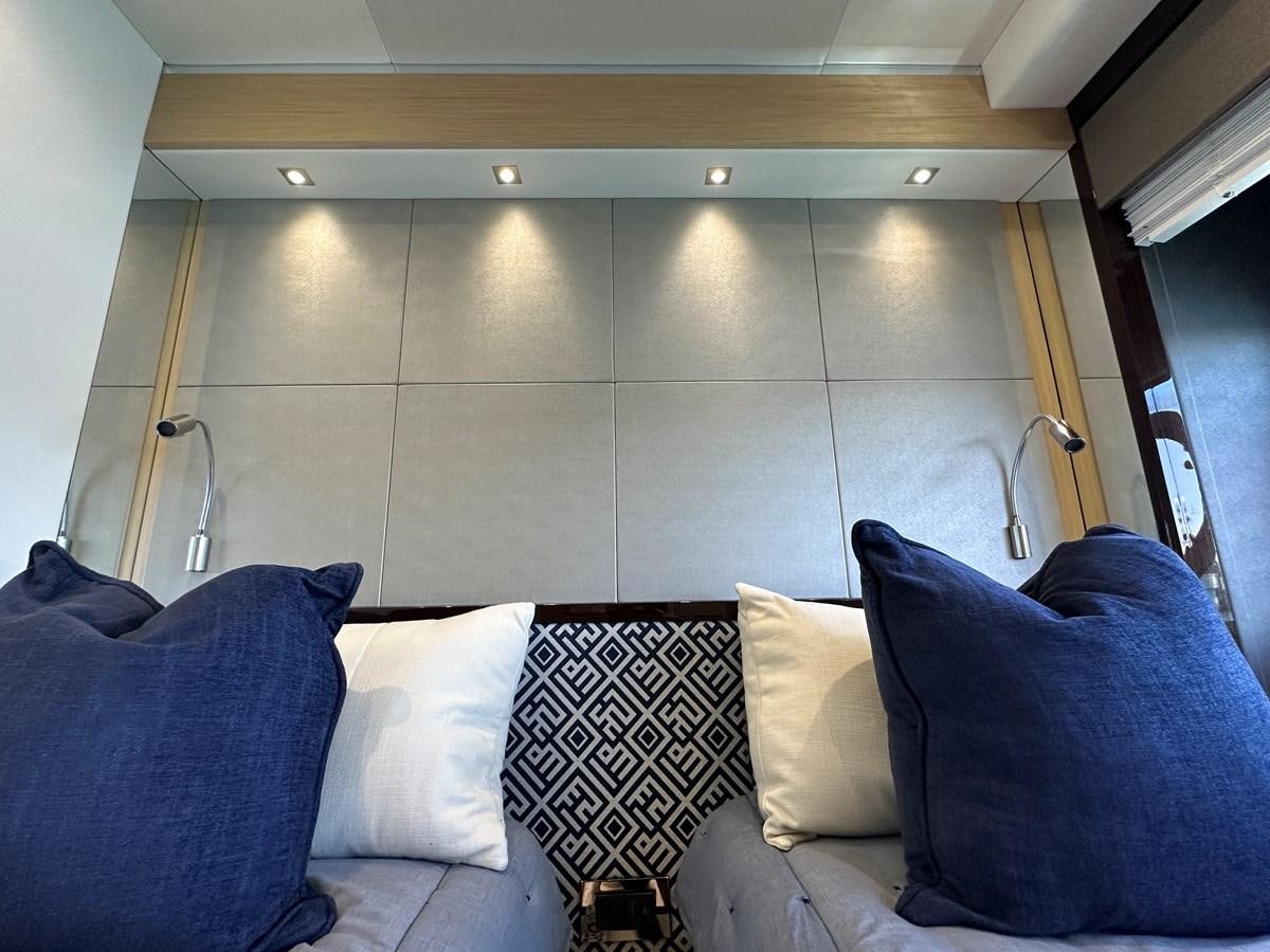 a room with a bed and pillows aboard K NUK Yacht for Sale