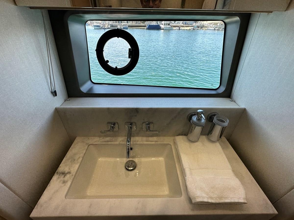 a sink with a screen on the wall aboard K NUK Yacht for Sale