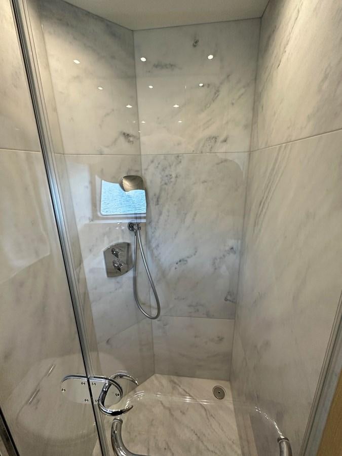 a shower with a glass door aboard K NUK Yacht for Sale