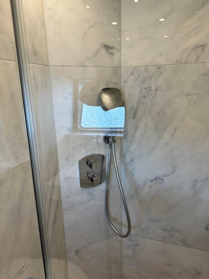 a shower with a metal handle aboard K NUK Yacht for Sale