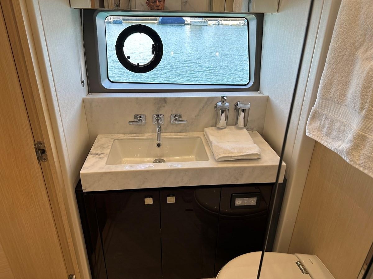 a tv on a wall aboard K NUK Yacht for Sale
